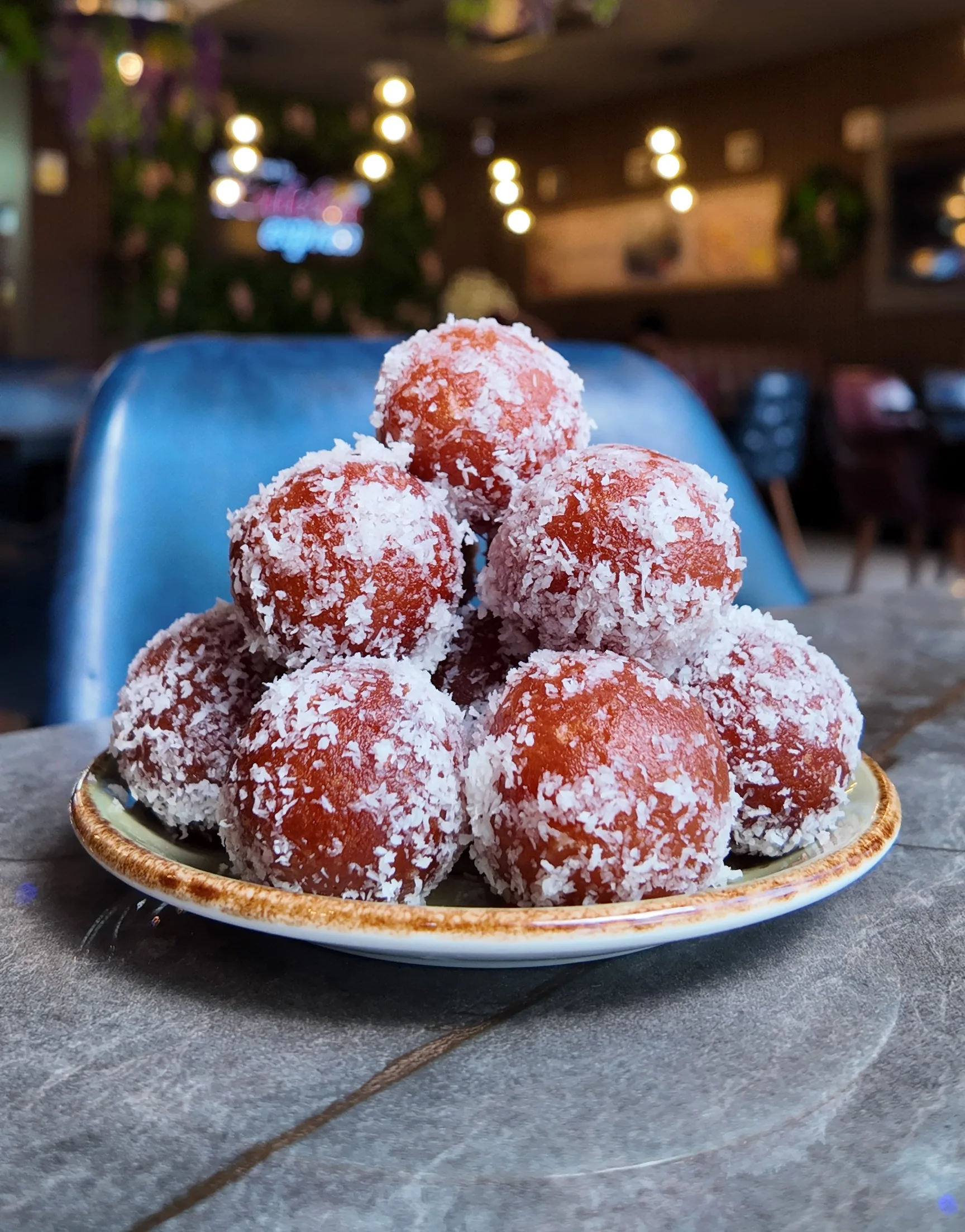 Warm gulab jamun in syrup.